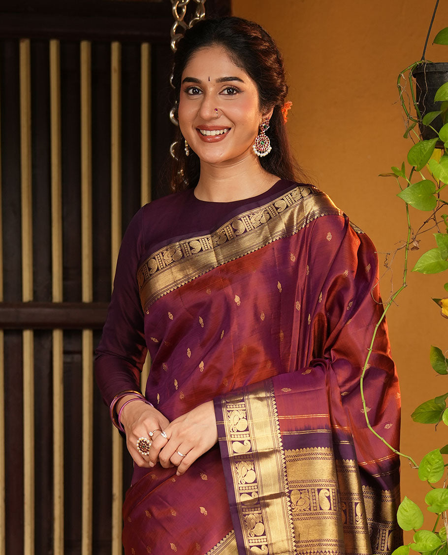 Red Vasundhara Silk Saree, Elevated with Zari Buttas All Over Its Body, Complemented by Contrast Border of Rekku, Manga and Mayil Designs, Grand Jaal Pallu, and Paired with a Contrast Blouse