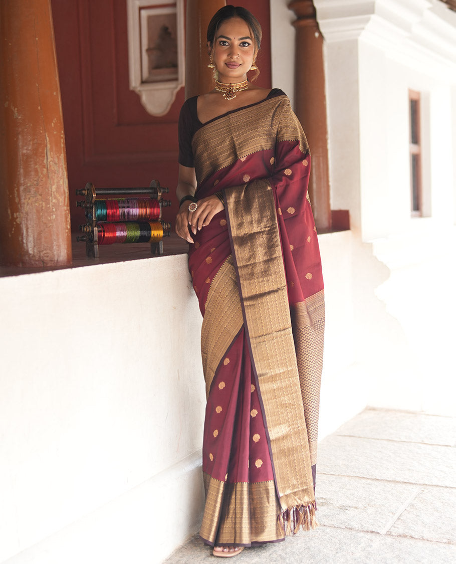 Wine and Maroon Vasundhara Lite Silk Mix Saree, Elevated with Zari Buttas All Over Its Body, Complemented by Contrast Border of Thilakam, Muthu, Banaras, Diamond, Mayil Kann, and Cross Kamalam Designs, Grand Pallu, and Paired with a Contrast Blouse