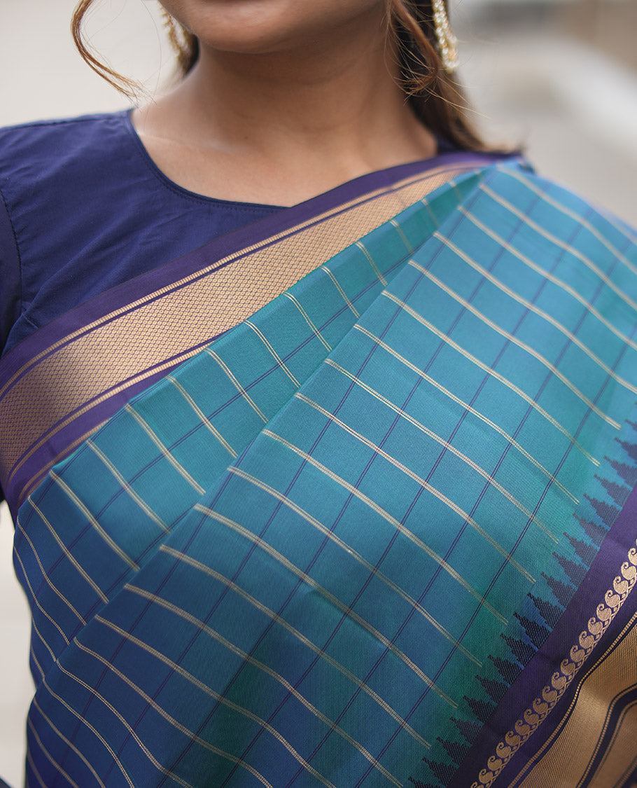 Mayil Color and Navy Blue Vasundhara Lite Silk Mix Saree, Graced with Checked Design All Over Its Body, Complemented by a Contrast Thazampoo Rekku Border of Manga Mokku, Muthu, and Mayil Kann Designs, Grand Pallu, and Paired with a Contrast Blouse