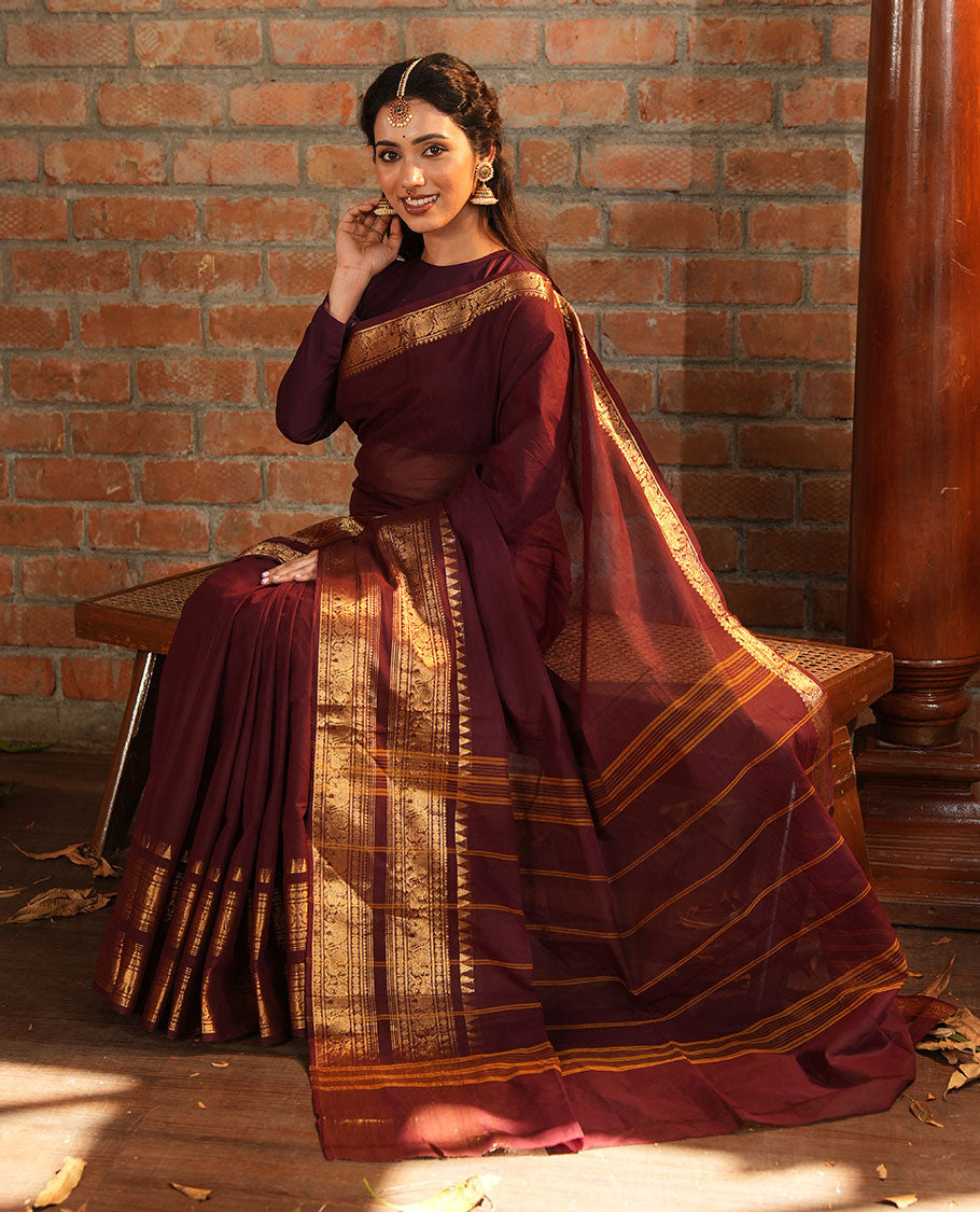 Brown Plain Chettinad Cotton Saree, Accentuated with a Gleaming Zari Rettai Pettu Border Featuring Elephant and Peacock Motifs, Subtly Striped Pallu, and Paired with a Matching Blouse