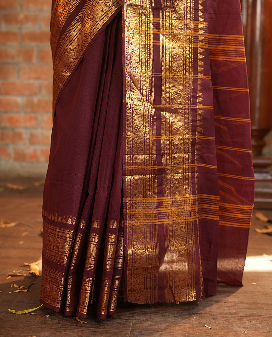 Brown Plain Chettinad Cotton Saree, Accentuated with a Gleaming Zari Rettai Pettu Border Featuring Elephant and Peacock Motifs, Subtly Striped Pallu, and Paired with a Matching Blouse