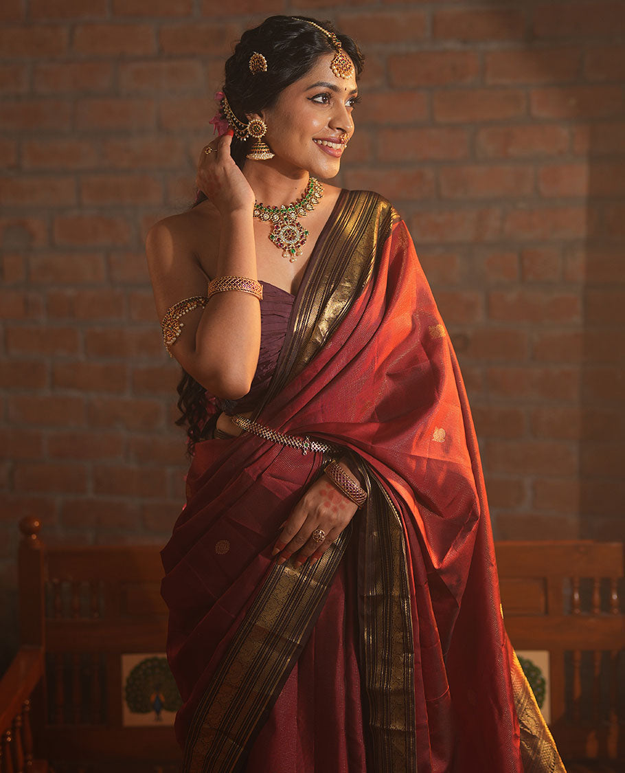 Crimson Red Vasundhara Silk Saree Featuring Vaira Oosi, and Annam Chakram Buttas, Complemented by a Contrast Border of Thilakam, Banaras, Mayil, Mayil Kann, Ara Bogudi, Muthu, and Banaras Designs, Grandly Woven Pallu, and a Contrast Blouse