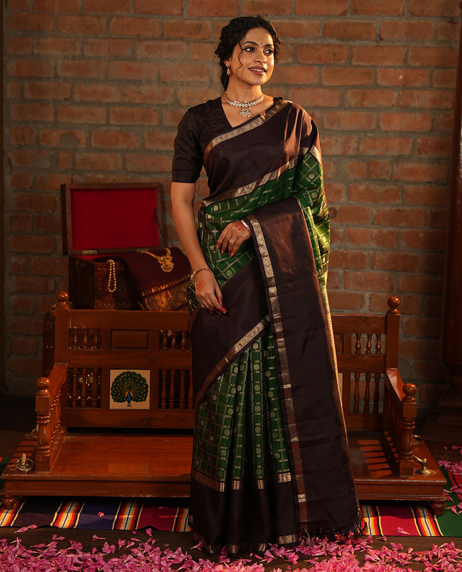 Green Vasundhara Silk Saree Richly Detailed with Chakram Butta Enclosed Checks, Highlighted with a Contrast Rettai Pettu of Rekku, Muthu, and Dhavana Kodi Designs, Zari-Rich Pallu of Jaal Designs, and Paired with a Contrast Blouse