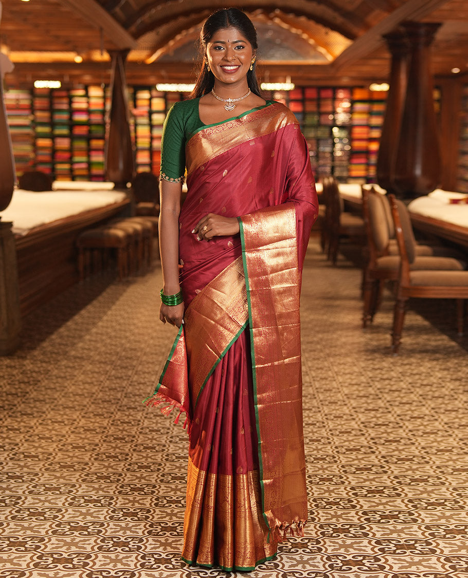 Maroon Budget Silk Saree, Dazzled with Zari Buttas, Highlighted by a Traditional Zari Border, Grand Ogee Pallu, and a Matching Blouse