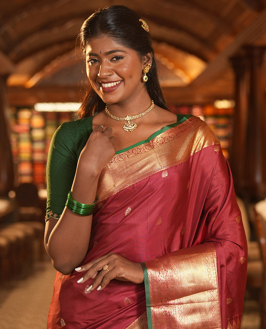 Maroon Budget Silk Saree, Dazzled with Zari Buttas, Highlighted by a Traditional Zari Border, Grand Ogee Pallu, and a Matching Blouse