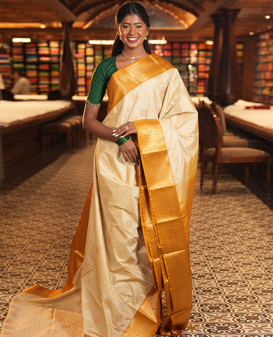 Biscuit-Yellow Budget Silk Saree, Woven with Zari Buttas, Complemented by a Contrast Traditional Zari Border, Grand Jaal Pallu, and a Contrast Blouse