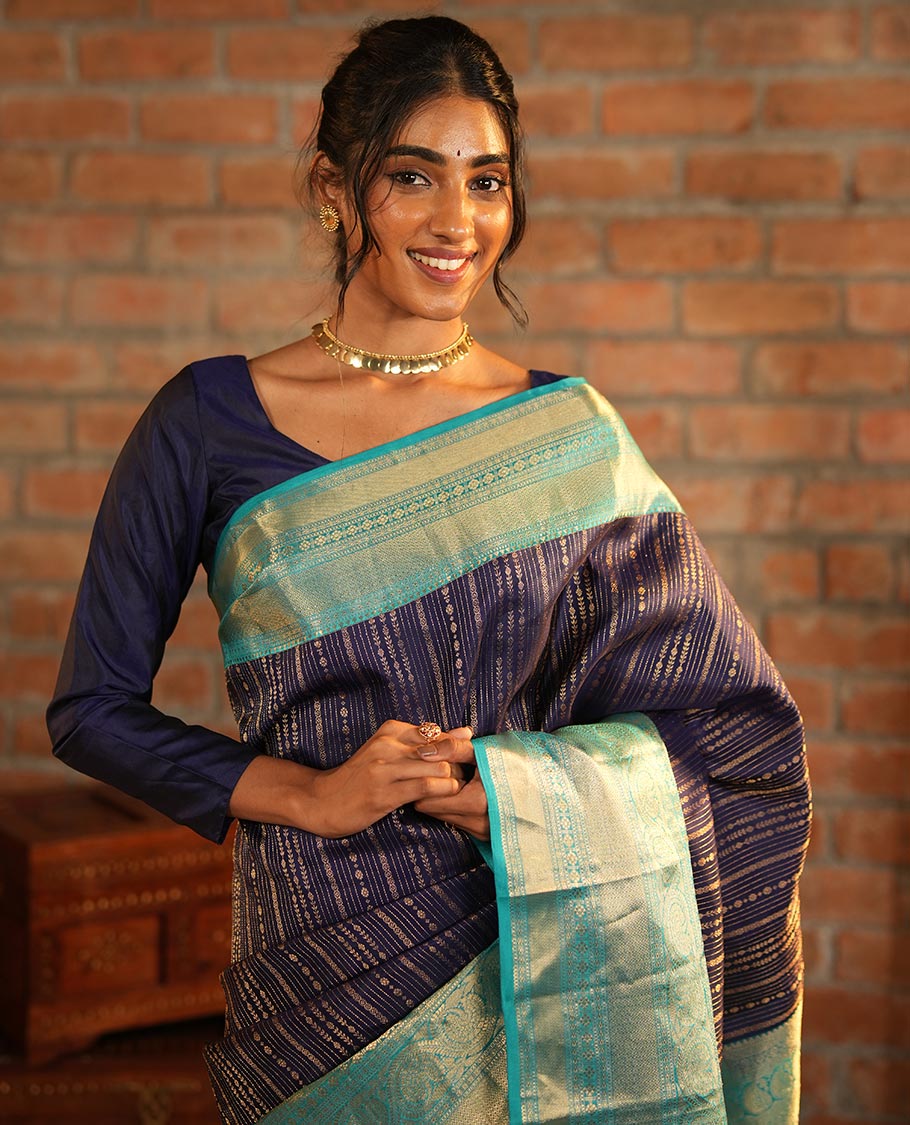 Blue Vasundhara Silk Saree Adorned with Jacquard Design Weave All Over Its Body, Complemented by a Contrast Border of Rekku, Muthu, Laddu Kamalam, Then Kuli Kann, and Dhavana Kodi Designs, Artfully Zari Woven Pallu, and Paired with a Contrast Blouse