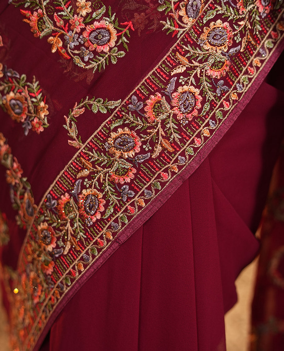 Wine Georgette Designer Saree Features Color-Thread Paisley Embroidery, a Matching Blouse