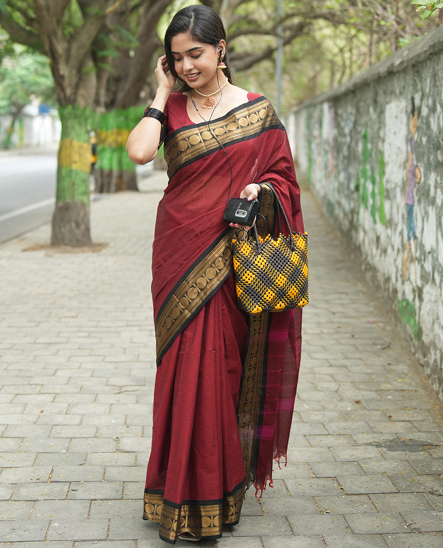Maroon Plain Chettinad Cotton Saree, Complemented by a Contrast Rudraksham Design Traditional Zari Border, Subtly Striped Pallu, and Paired with a Matching Blouse