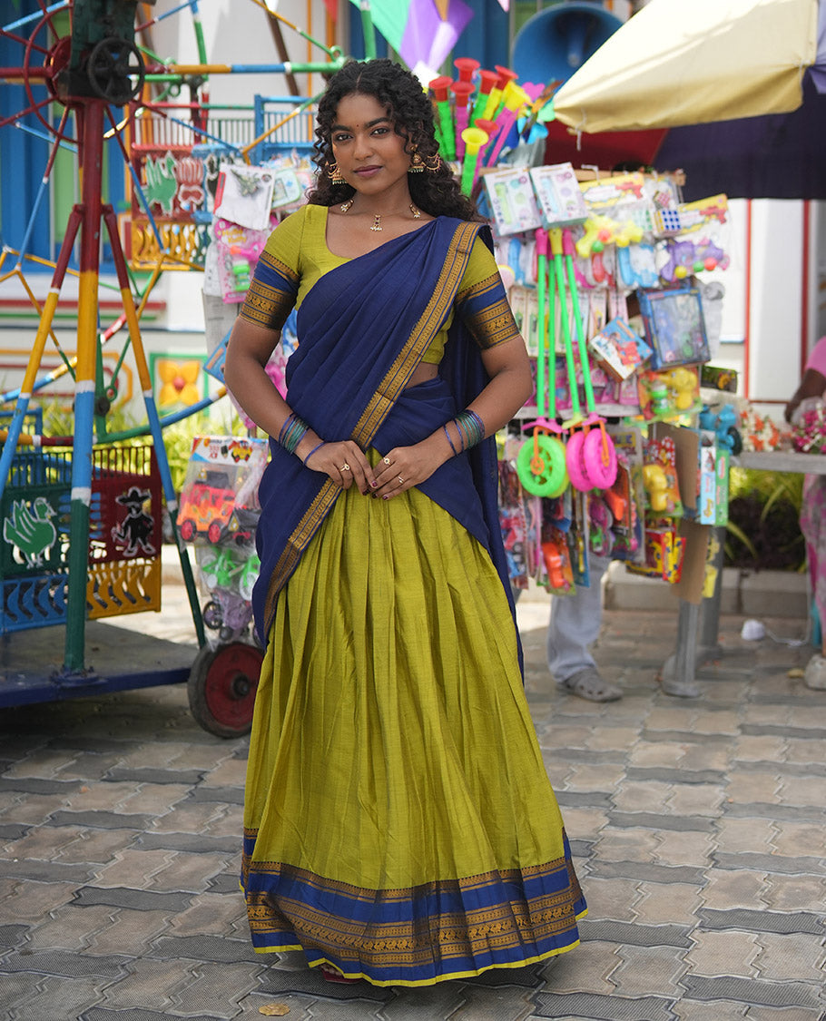 Liril Green-Royal Blue Mercerised Cotton Half-Saree Features Plain Skirt, Contrast Traditional Annam-Motif Border, a Matching Blouse, and Contrast Dhavani
