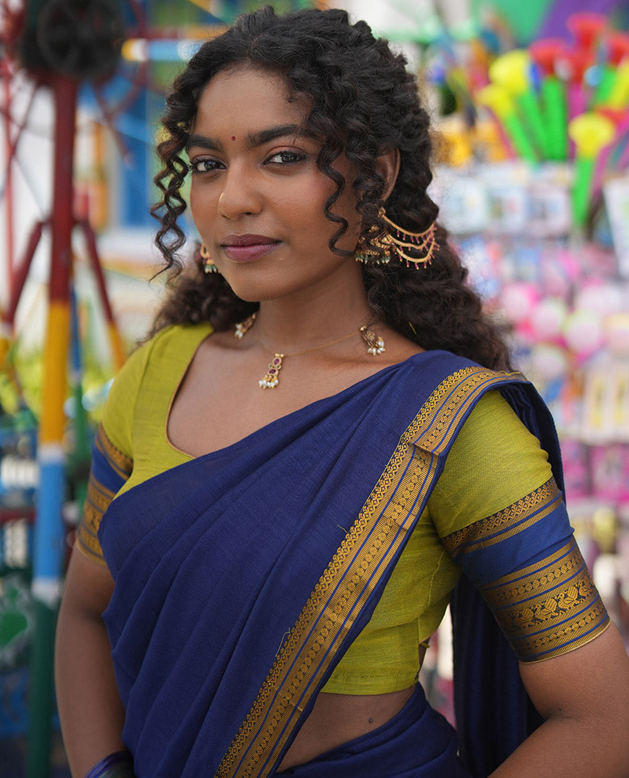 Liril Green-Royal Blue Mercerised Cotton Half-Saree Features Plain Skirt, Contrast Traditional Annam-Motif Border, a Matching Blouse, and Contrast Dhavani