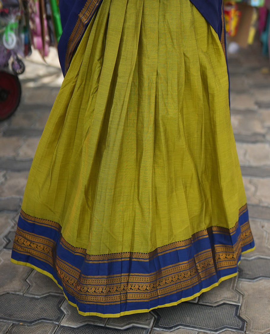 Liril Green-Royal Blue Mercerised Cotton Half-Saree Features Plain Skirt, Contrast Traditional Annam-Motif Border, a Matching Blouse, and Contrast Dhavani