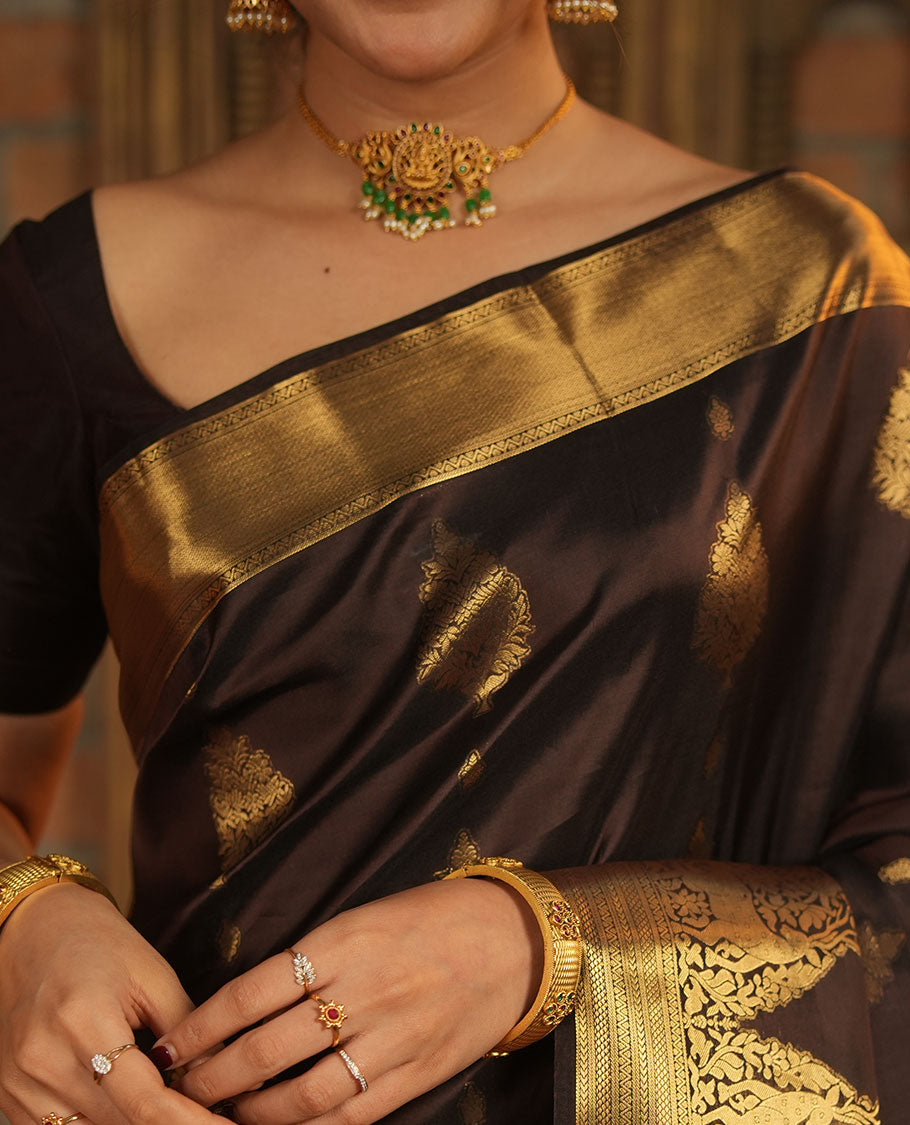Brown Vasundhara Lite-Silk Mix Saree, Elevated with Zari Buttas All Over Its Body, Highlighted by Zari Border of Neli, Kuyil Kann, Kathir, and Maan Designs, Gracefully Embellished Pallu of Jaal Design, and Paired with a Matching Blouse