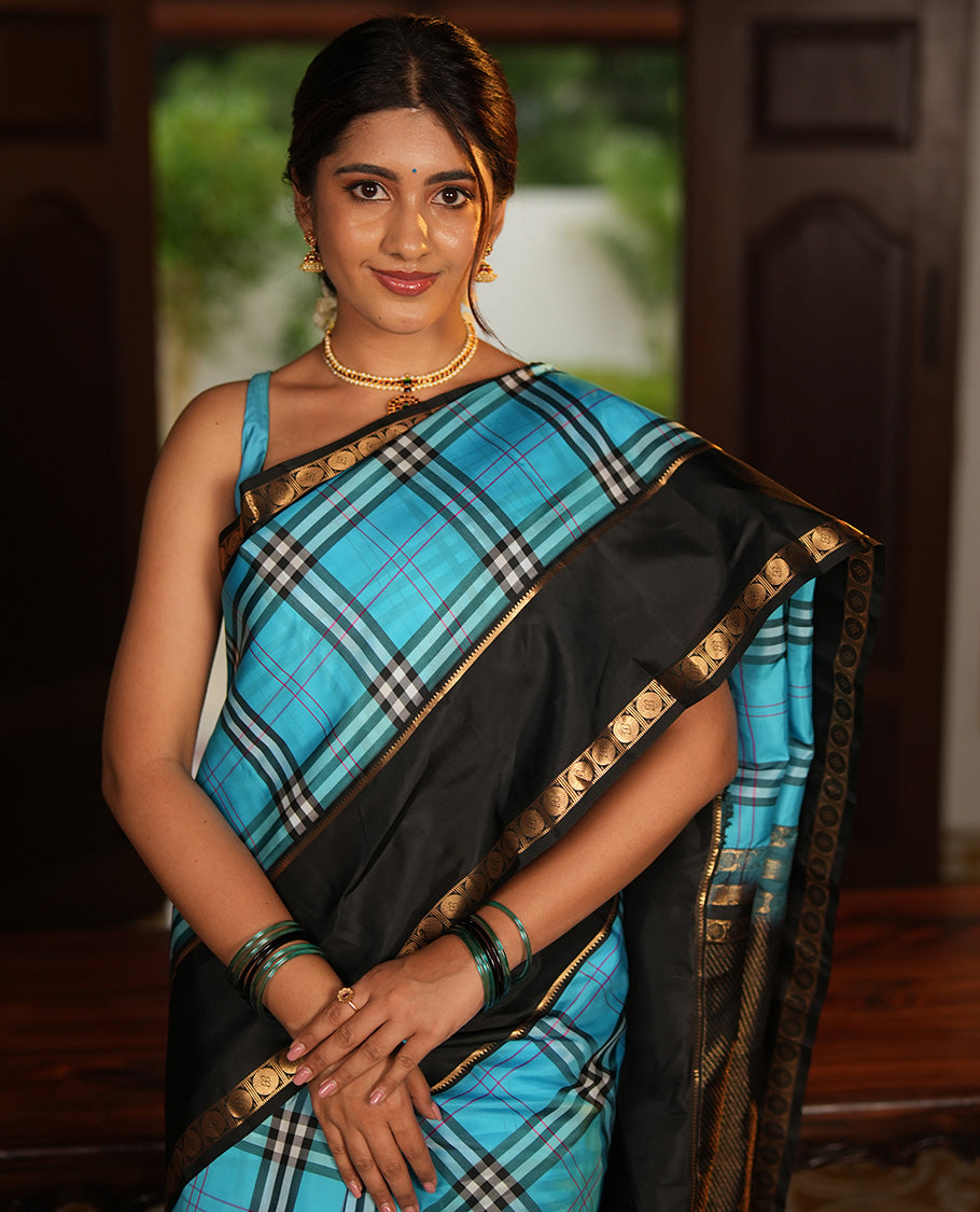 Blue-Black Vasundhara Lite Silkmix Saree Features Checks, Contrast Rettai Pettu Rekku-Poun Border, Zari-Striped Pallu, and a Contrast Blouse