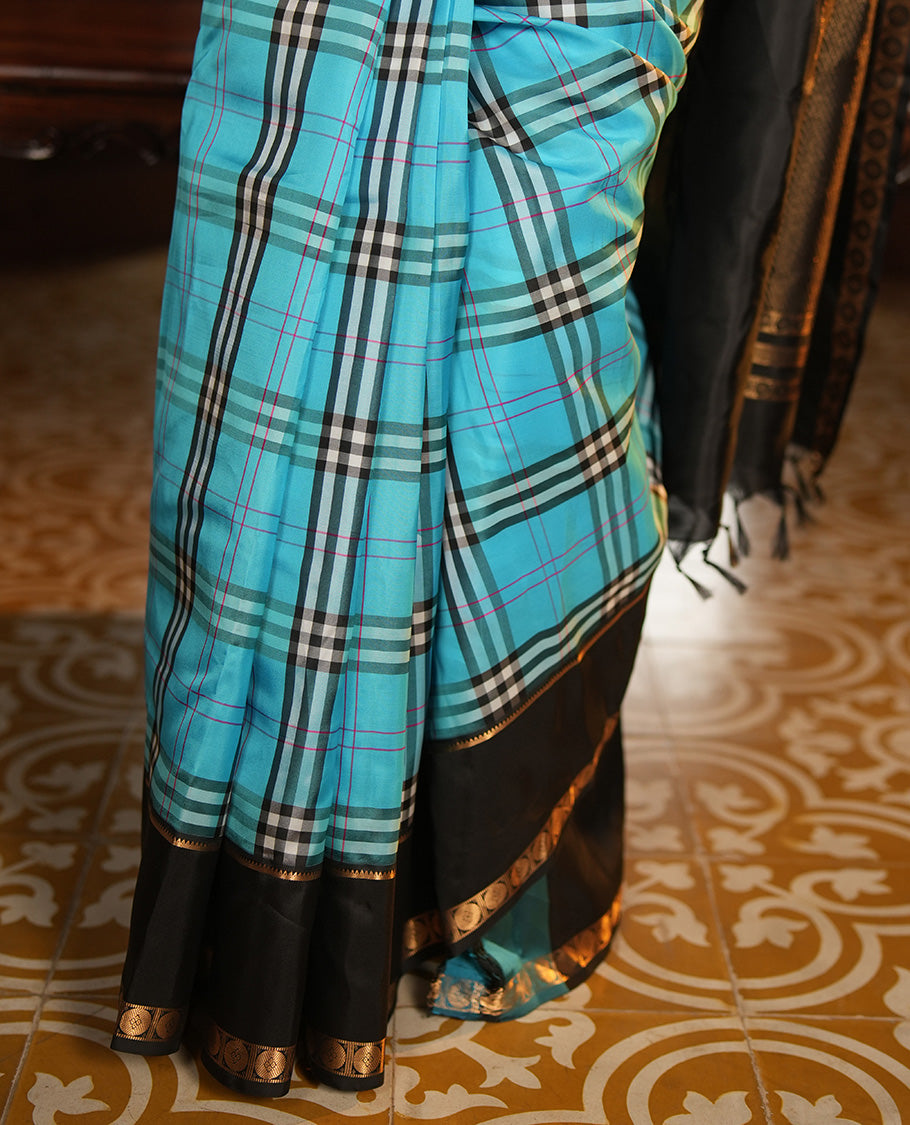 Blue-Black Vasundhara Lite Silkmix Saree Features Checks, Contrast Rettai Pettu Rekku-Poun Border, Zari-Striped Pallu, and a Contrast Blouse
