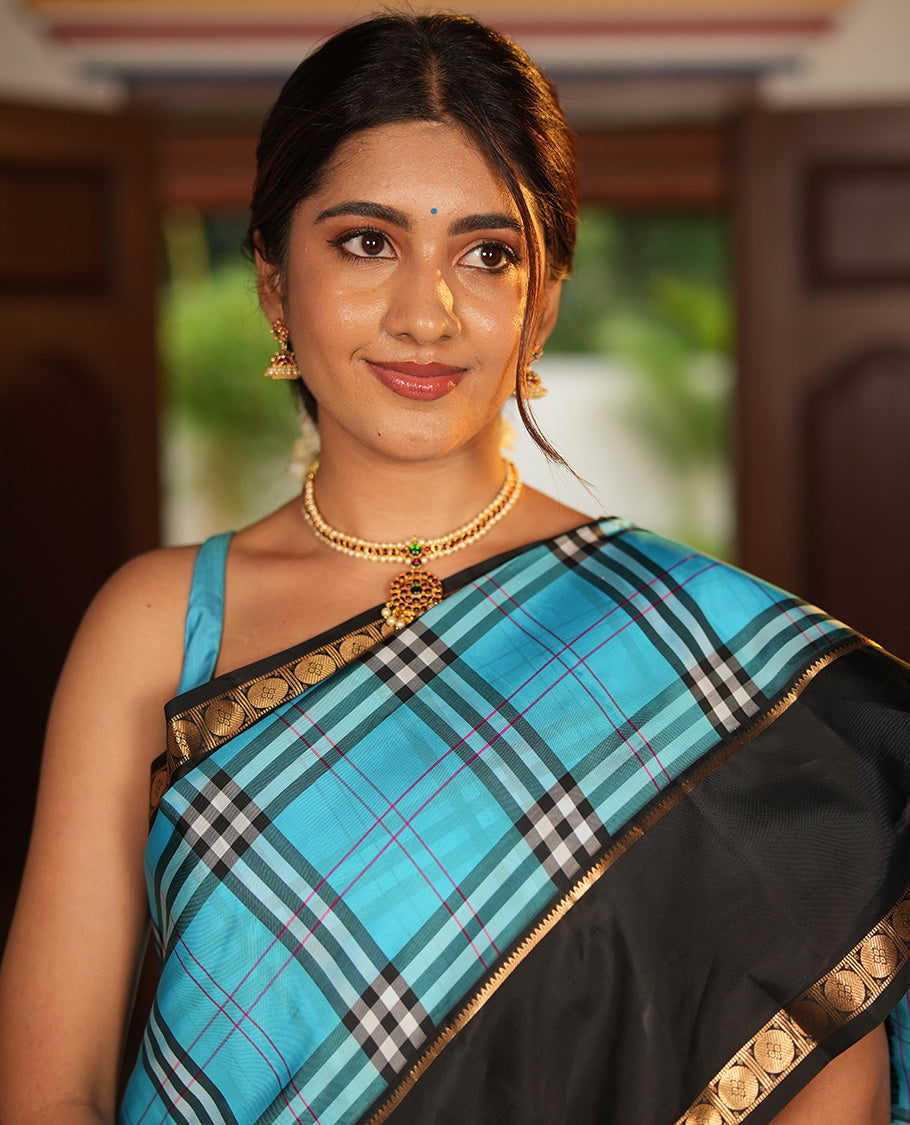 Blue-Black Vasundhara Lite Silkmix Saree Features Checks, Contrast Rettai Pettu Rekku-Poun Border, Zari-Striped Pallu, and a Contrast Blouse
