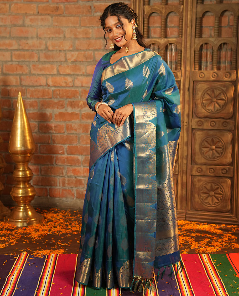 Blue Vasundhara Lite-Silk Mix Saree, Embellished with Zari Buttas All Over Its Body, Highlighted by Zari Border of Neli, Kuyil Kann, Kathir, and Maan Designs, Gracefully Embellished Pallu of Jaal Design, and Paired with a Matching Blouse