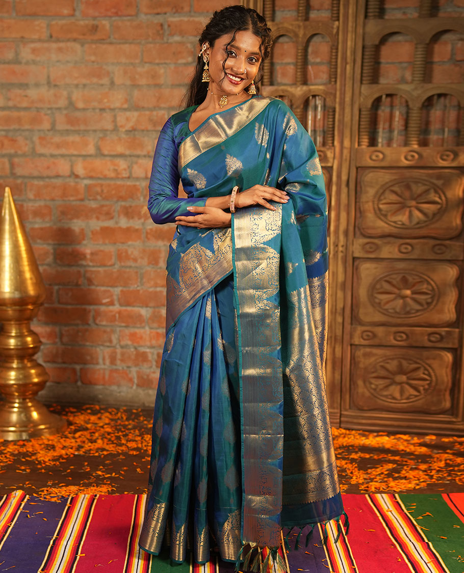 Blue Vasundhara Lite-Silk Mix Saree, Embellished with Zari Buttas All Over Its Body, Highlighted by Zari Border of Neli, Kuyil Kann, Kathir, and Maan Designs, Gracefully Embellished Pallu of Jaal Design, and Paired with a Matching Blouse
