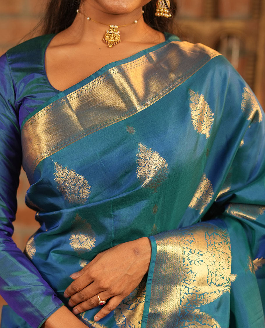 Blue Vasundhara Lite-Silk Mix Saree, Embellished with Zari Buttas All Over Its Body, Highlighted by Zari Border of Neli, Kuyil Kann, Kathir, and Maan Designs, Gracefully Embellished Pallu of Jaal Design, and Paired with a Matching Blouse