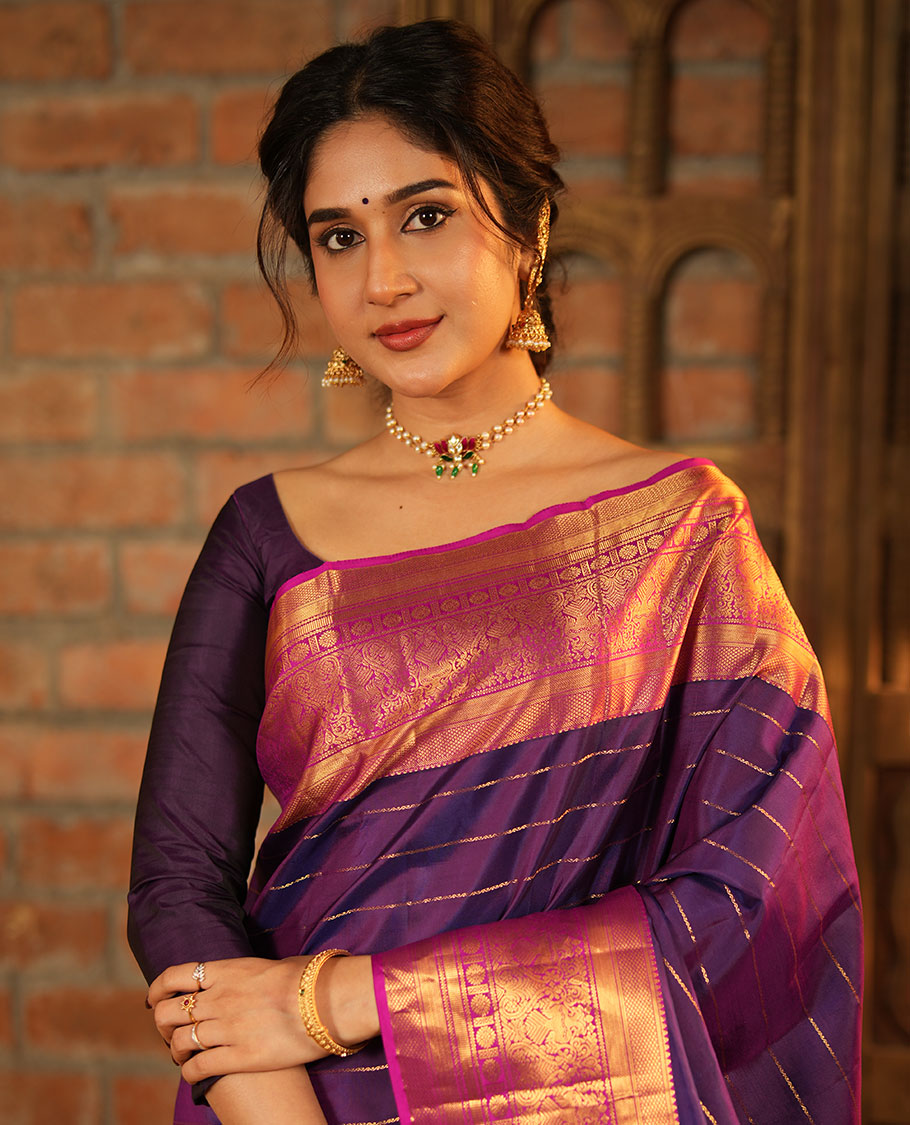 Purple Vasundhara Silk Saree, Enriched with Neli Stripes On Its Body, Complemented by Captivating Contrast Border of Mayil Kann, Vanki, Iru Thalaipakshi, Chakram, and Neli Designs, Grand Pallu, and Paired with a Contrast Blouse