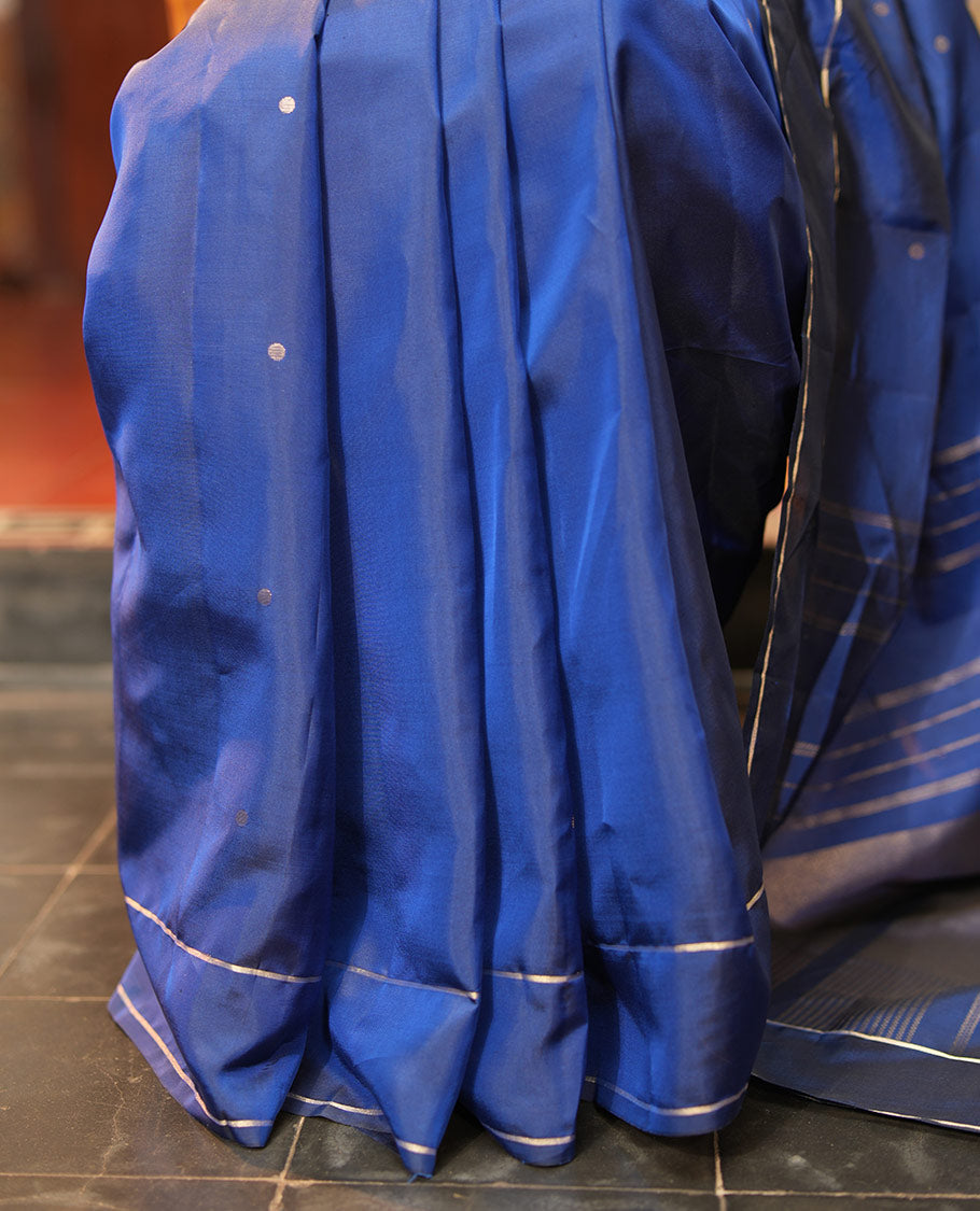 Navy Blue Vasundhara Lite Silk Saree, Subtly Sparkled with Paisa Zari Buttas Across Its Body, Highlighted Zari Border of Horizontal Stripes, Gleaming Pallu of Seppu Rekku Designs, and Paired with a Matching Blouse