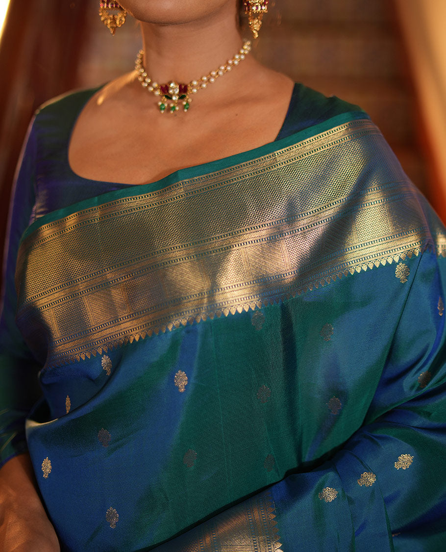 Blue Vasundhara Lite Silk Mix Saree, Enriched with Zari Buttas All Over Its Body, Highlighted by a Zari Border of Traditional Zari Designs, Grandly Zari Decked Up Pallu, and Paired with a Matching Blouse