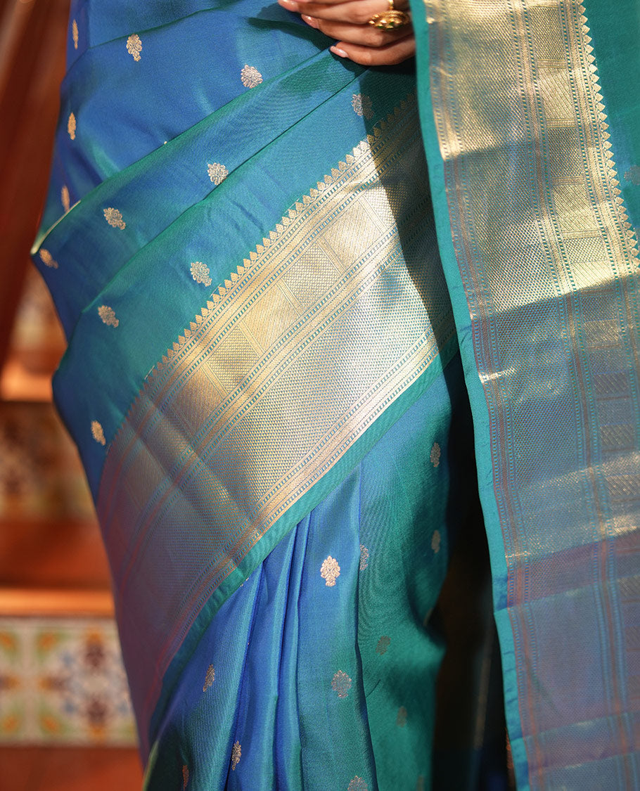 Blue Vasundhara Lite Silk Mix Saree, Enriched with Zari Buttas All Over Its Body, Highlighted by a Zari Border of Traditional Zari Designs, Grandly Zari Decked Up Pallu, and Paired with a Matching Blouse