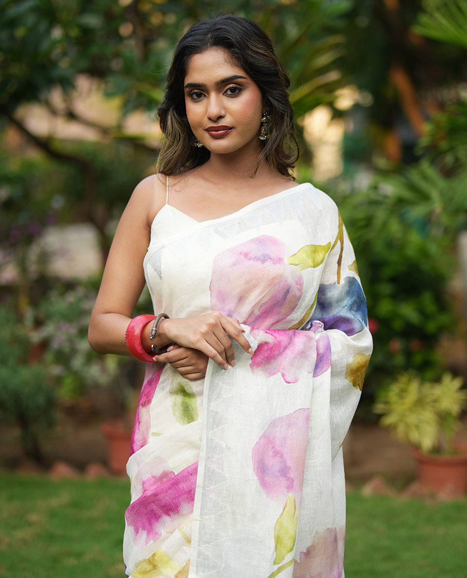 Cream-Base Linen Saree, Highlighted by Floral-Themed Paint Splashes, Hand-Brush Painted All Over Its Body, Sparsely Woven Temple Border, and Paired with a Matching Blouse