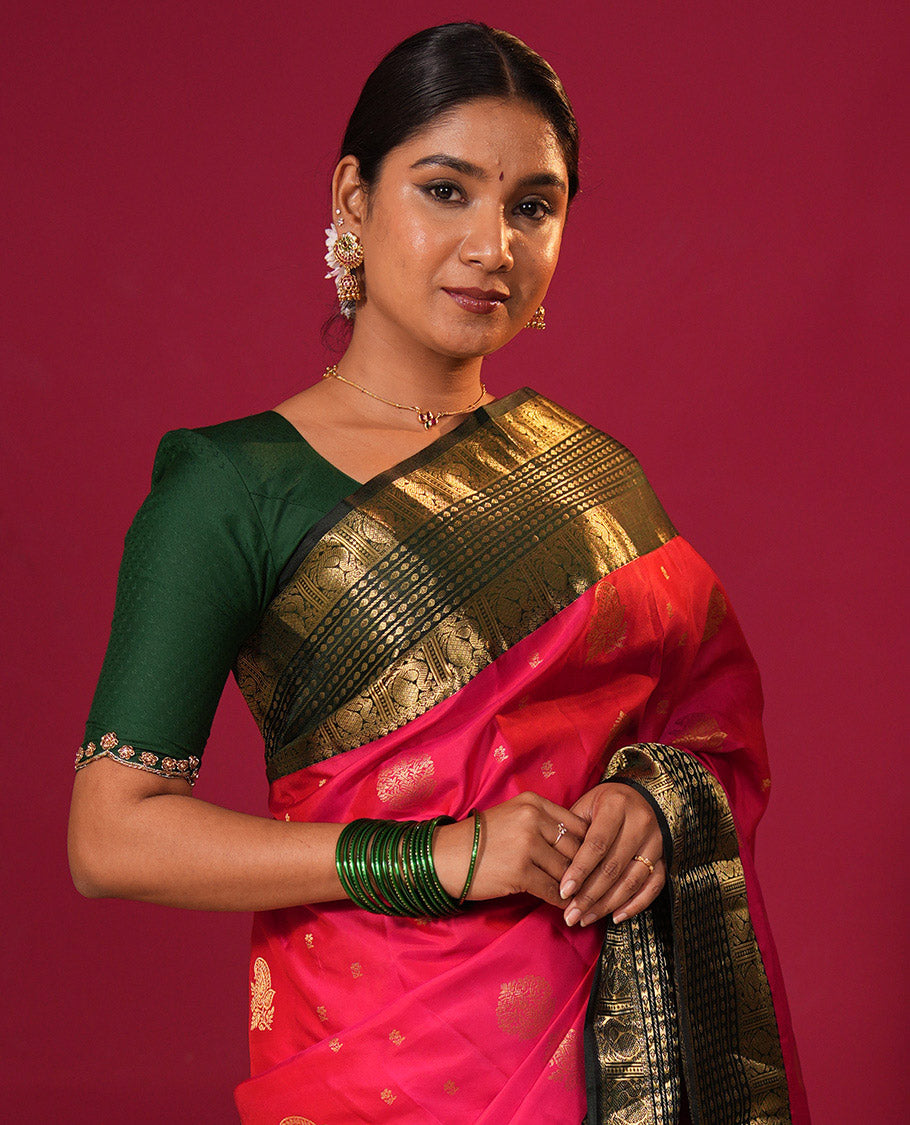 Tomato red zari buttas silk saree, contrast border of thilakam mokku, banaras, thilakam, and mayil designs, and zari-rich jaal design