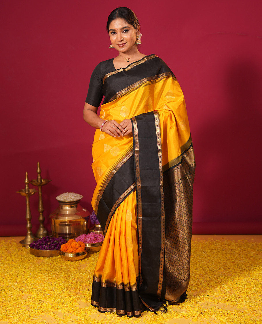 Yellow zari buttas silk saree, contrast thazampoo rekku rettai pettu border of banaras, and manga designs, and jaal pallu
