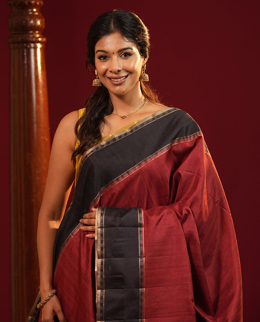 Maroon Plain Semi-Tussar Silk Saree, Complemented by a Contrast Geometric Design Border, Subtly Zari Striped Pallu, and Paired with a Contrast Floral Vine Printed Blouse