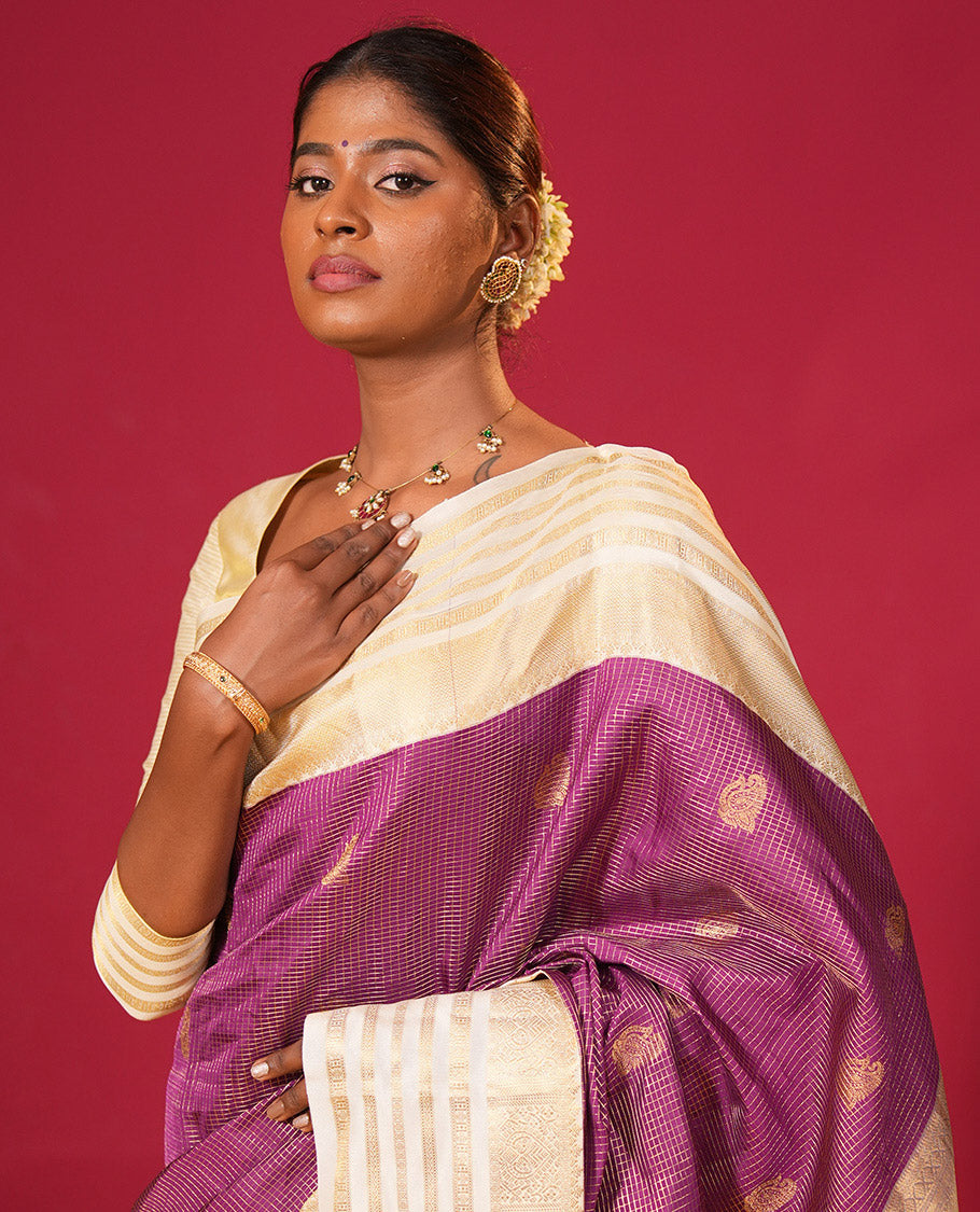 Purple zari checked and zari buttas silk saree, contrast varisai pettu border of jaal, muthu, neli, and rudraksham motifs