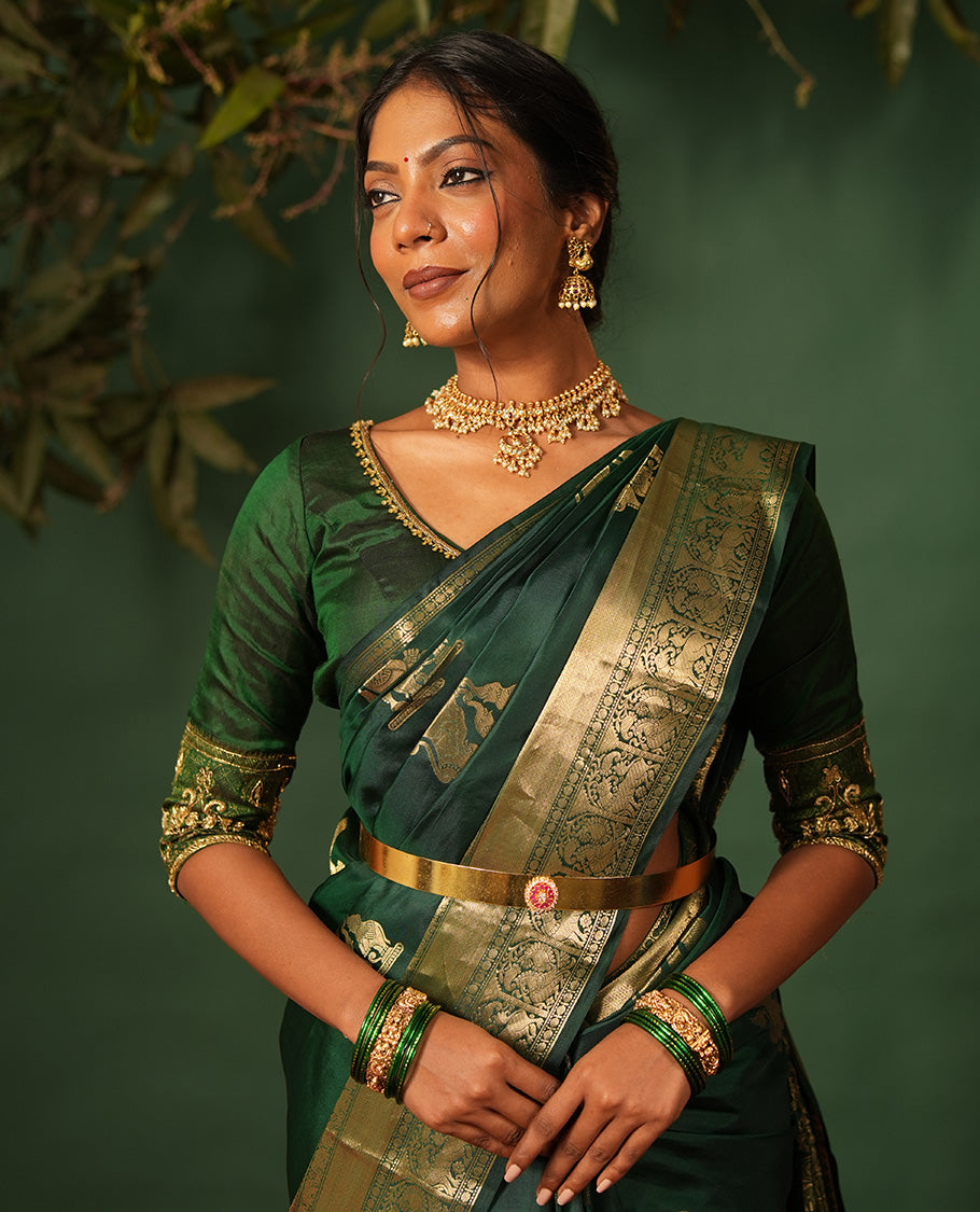 Green singam and yaanai zari buttas woven silk saree, zari border of mayil kann, rudraksham, muthu, mayil, and yaali designs, and intricate pallu