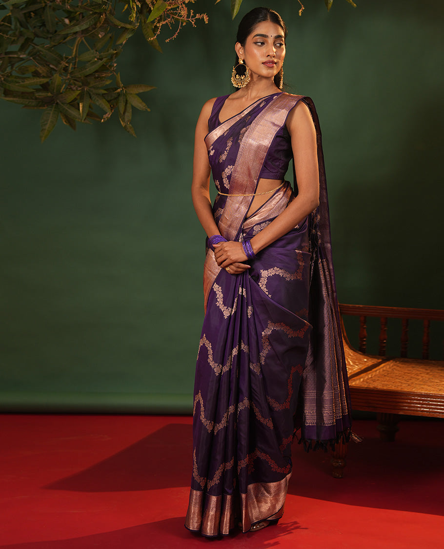 Purple Vasundhara Silk Saree, Accentuated with Floral Jaal Jacquard, Complemented by Zari Border of Thilakam Mokku, Lavangam, and Jaal Designs, Grandly Woven Pallu, and Paired with a Matching Blouse
