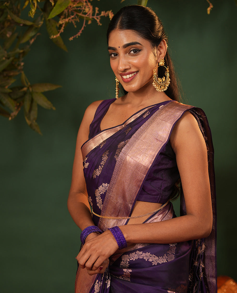 Purple Vasundhara Silk Saree, Accentuated with Floral Jaal Jacquard, Complemented by Zari Border of Thilakam Mokku, Lavangam, and Jaal Designs, Grandly Woven Pallu, and Paired with a Matching Blouse