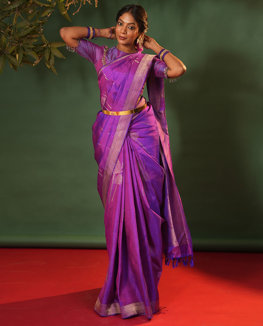 Violet Vasundhara Silk Saree Accentuated with Thazampoo Rekku, and Vel Buttas, Complemented by Zari Border of Manga, Muthu, Kathir, Neli, and Vanki Designs, Pallu Adorned with Jaal Designs, and Paired with a Matching Blouse