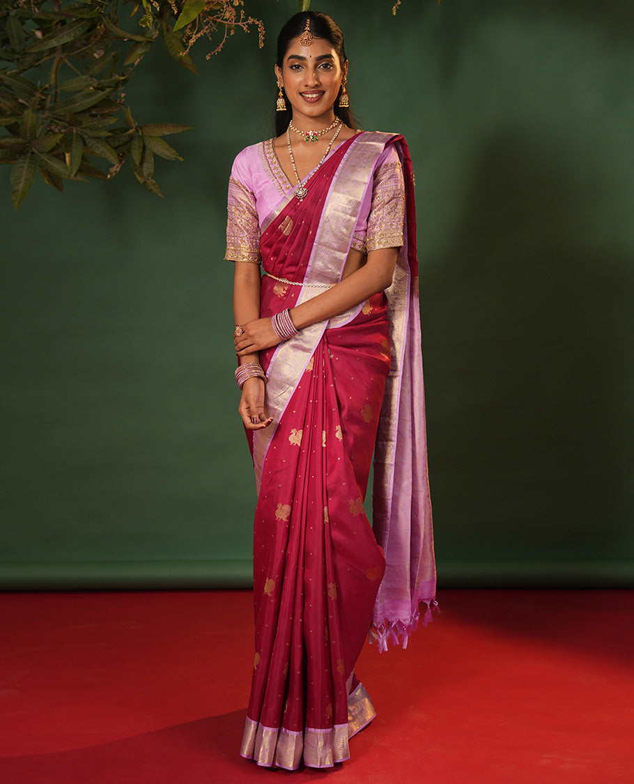 Pink Vasundhara Silk Saree Elevated with Yaanai and Mayil Buttas, Complemented by a Contrast Border of Muthu, Kathir, Mayil, and Yaanai Designs, Pallu Embellished with Diagonal Stripes, and Paired with a Contrast Blouse