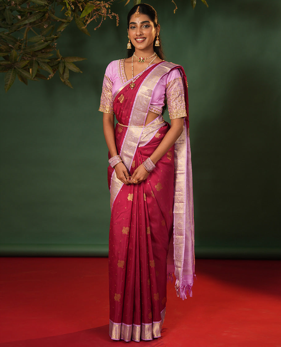 Pink Vasundhara Silk Saree Elevated with Yaanai and Mayil Buttas, Complemented by a Contrast Border of Muthu, Kathir, Mayil, and Yaanai Designs, Pallu Embellished with Diagonal Stripes, and Paired with a Contrast Blouse