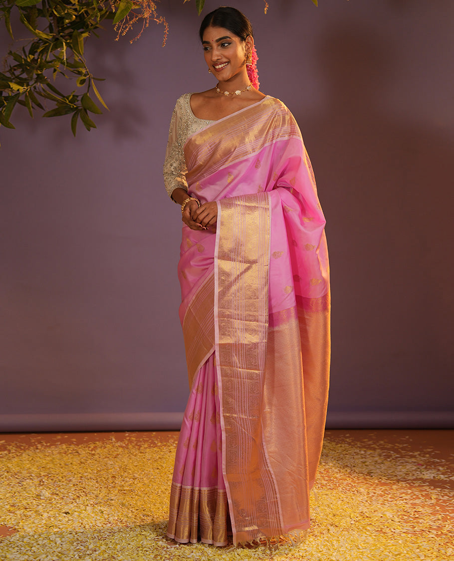 Pink mayil buttas Vasundhara silk saree, zari border of muthu, diamond, mayil kann, kamalam, and mayil designs, and intricate pallu