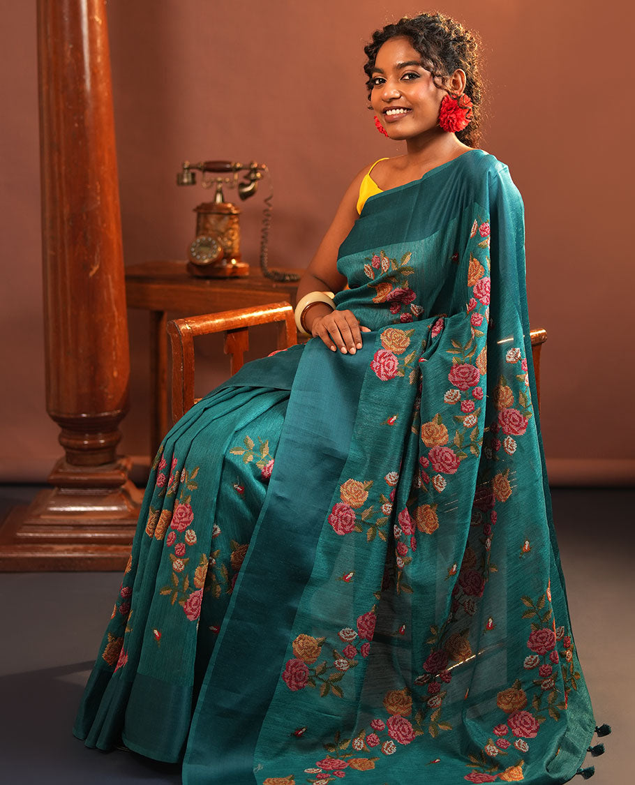 Rama Blue Green-Silk Saree, Colorfully Highlighted with Rose Motifs Cross Stitch Embroidery on Its Body, Subtly Sparkled by a Plain Border, Pallu of Rose Cross Stitch Embroidery, and Paired with a Contrast Blouse