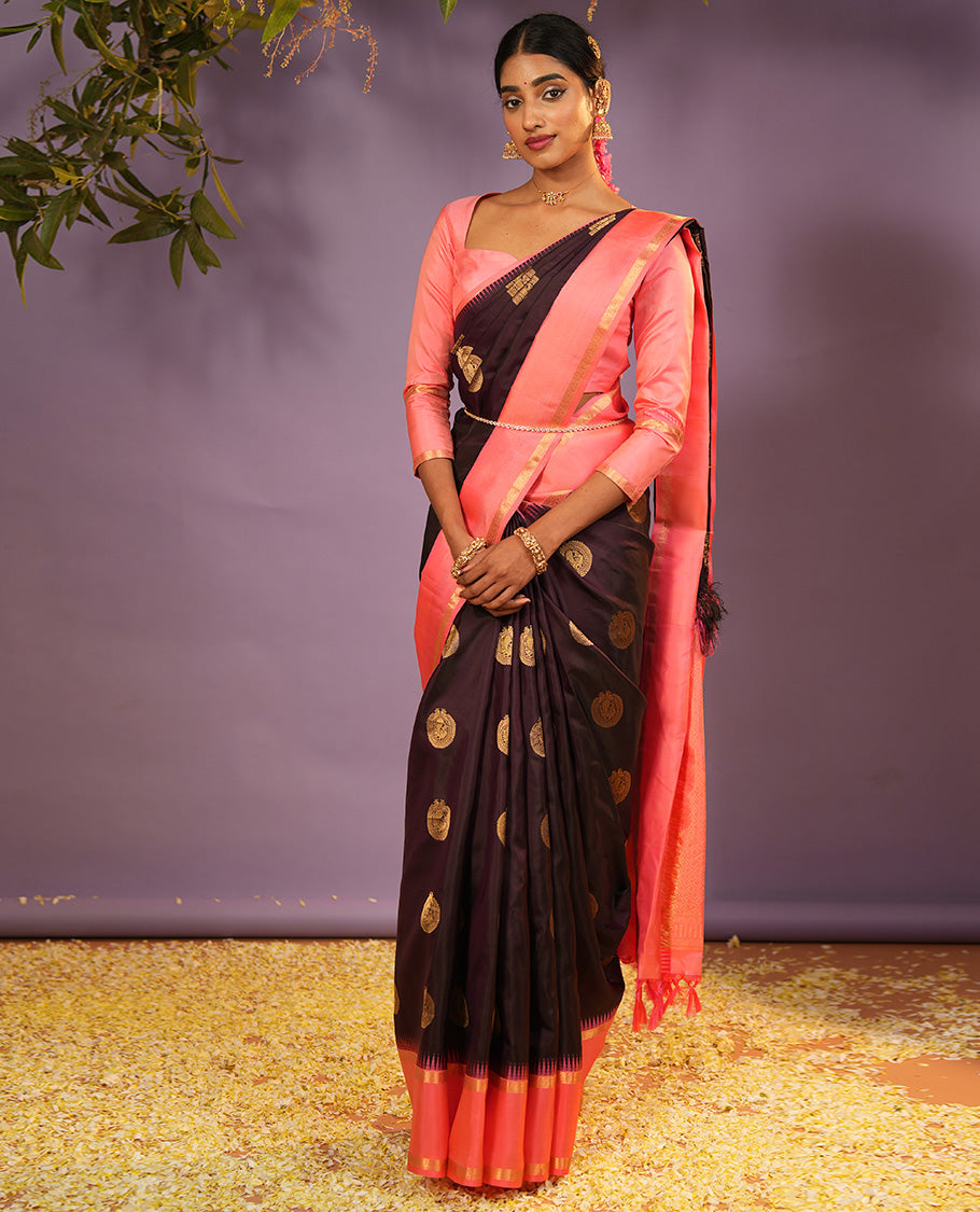 Coffee Brown Vasundhara Silk Saree Accentuated with Round Mayil Buttas, Complemented with Contrast Rettai Pettu Thazampoo Rekku Zari Border, Beautifully Woven Pallu of Jaal Design, and Paired with a Contrast Blouse