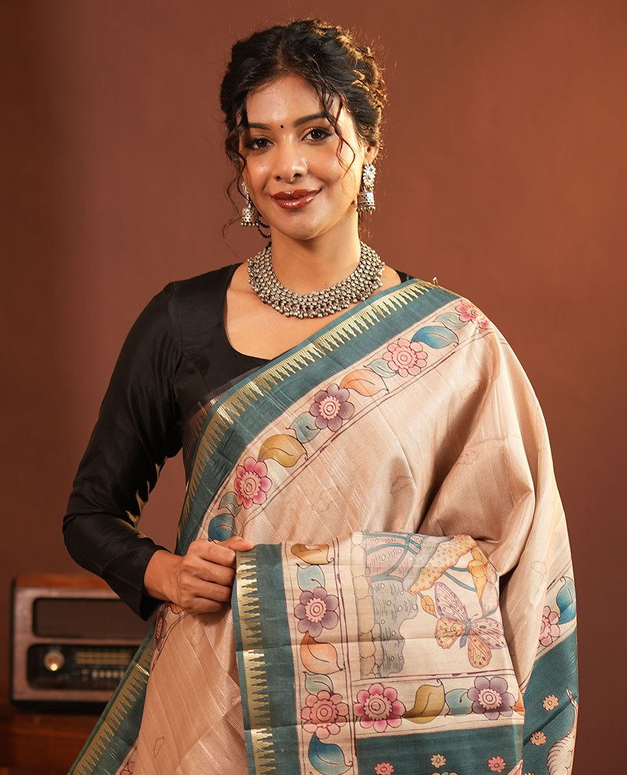 Chikku-Green Fancy Tussar Saree, Artfully Detailed with Kalamkari-Style Floral Print Across Its Body, Complemented by Contrast Temple Zari Border, a Colourfully Kalamkari Printed Pallu, and Paired with a Plain Blouse