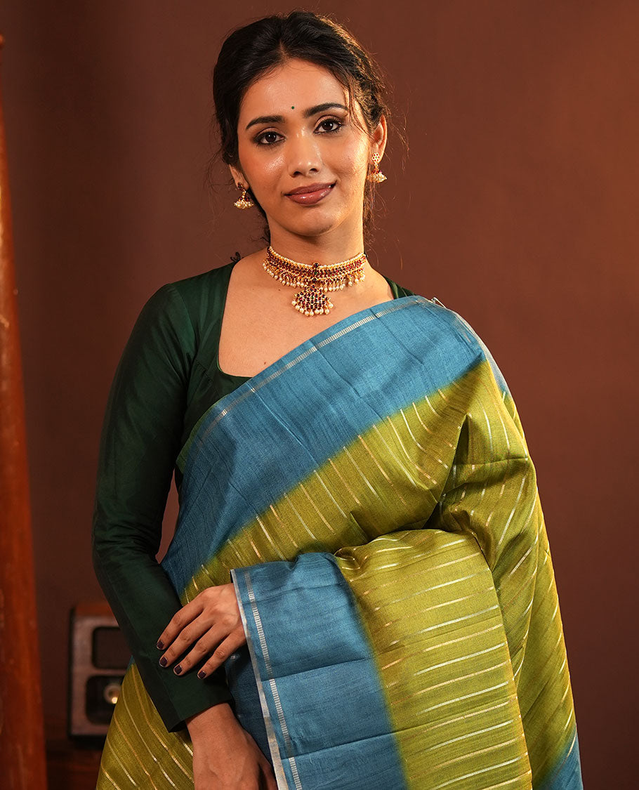 Pista Green Fancy Tussar Saree, Highlighted by Vertical Zari Stripes Across Its Body, Complemented by Captivating Contrast Geometric Patterned Border, Subtle Pallu and Paired with a Contrast Blouse