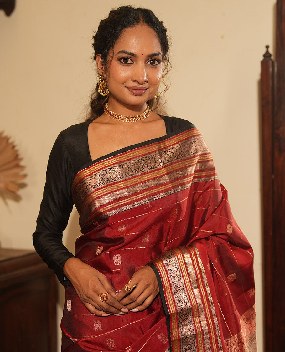 Maroon Striped-Mayil Buttas Vasundhara Silksaree, Contrast Border of Mayil Kann,Mayil, and Yaali, Jaal Pallu, and a Contrast Blouse
