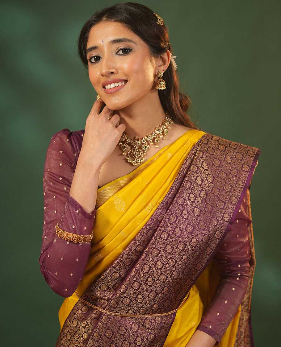 Yellow Vasundhara Silk Saree Featuring Floral Zari Buttas and Skrit-Border-Style Contrast Annam Chakram Butta Enclosed Checked Border, Majestically Zari Detailed Pallu, and Paired with a Contrast Blouse