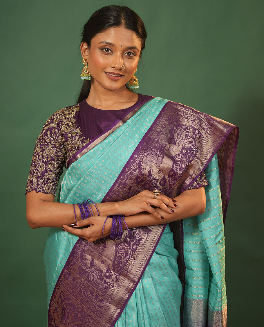 Blue Vasundhara Silk Saree Delicately Woven with Varai Oosai and Rudraksham Buttas, Captivating Contrast Kuthirai Motifs Zari Woven Border, Intricately Designed Pallu, and Paired with a Contrast Blouse