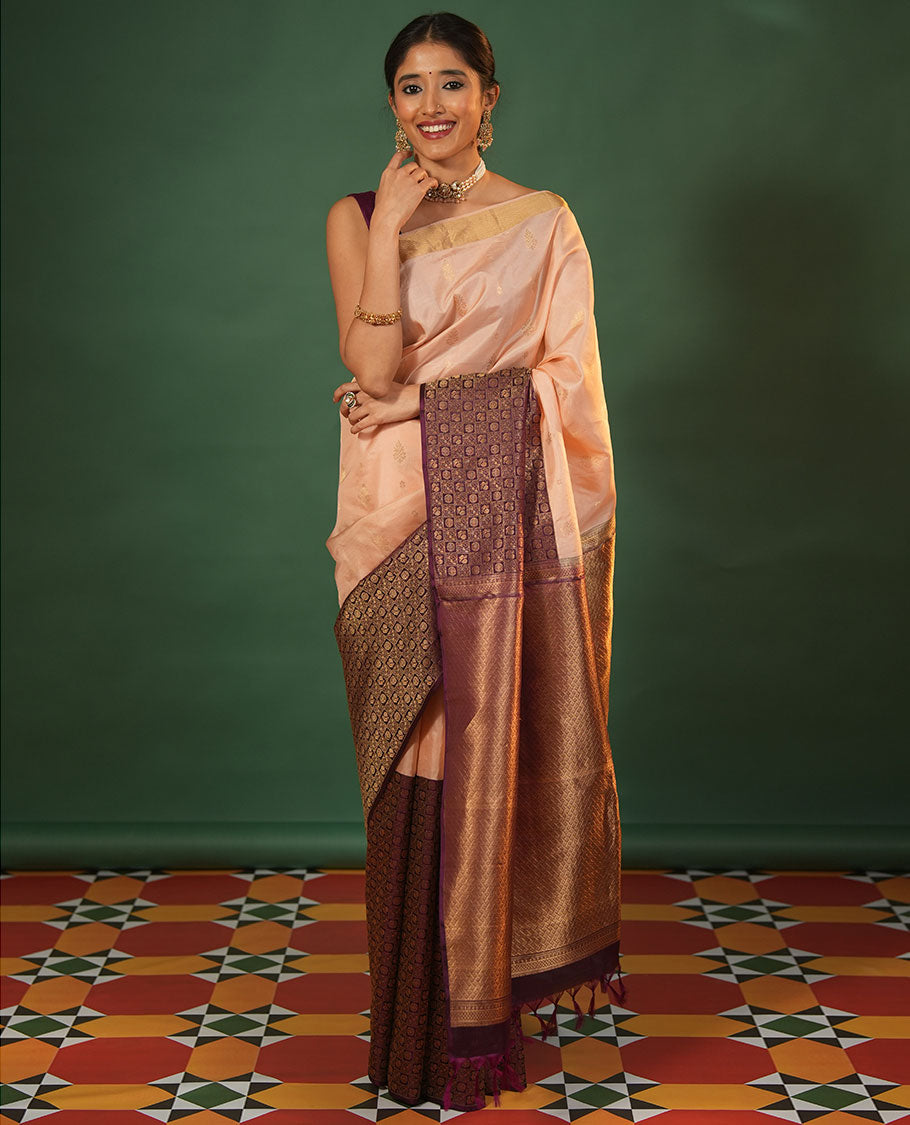 Peach Vasundhara Silk Saree Featuring Floral Zari Buttas and Skrit-Border-Style Contrast Annam Chakram Butta Enclosed Checked Border, Majestically Zari Detailed Pallu, and Paired with a Contrast Blouse