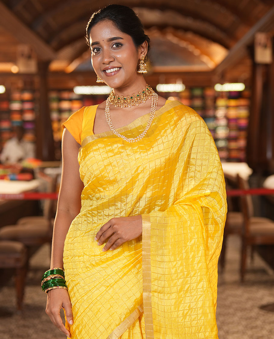 Yellow-Checked Banana Pith Saree, a Zari Piping Border, Striped Pallu, a Matching Blouse