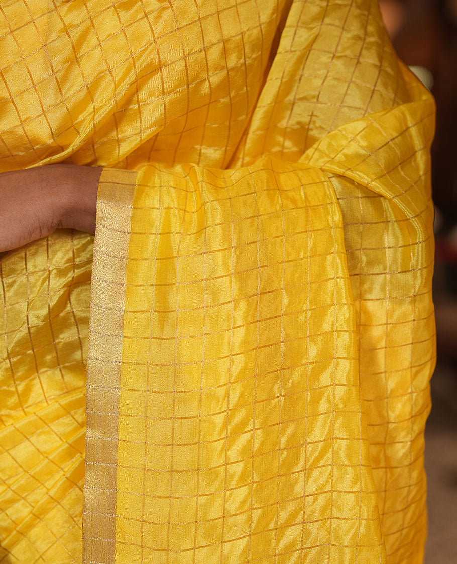 Yellow-Checked Banana Pith Saree, a Zari Piping Border, Striped Pallu, a Matching Blouse