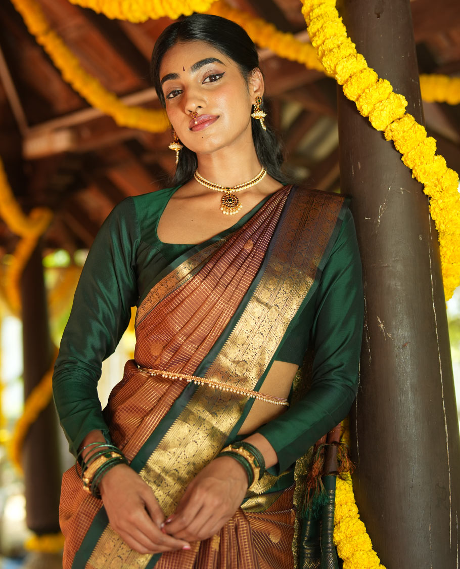Honey-Coloured Zari Checked with Annam Chakram Buttas Vasundhara silk saree, Contrast Rettai Pettu Border of Ara Bogudi, Muthu, Banaras, Puli Nagam, Iruthalai Pakshi, and Chakram Designs, and Intricate Pallu